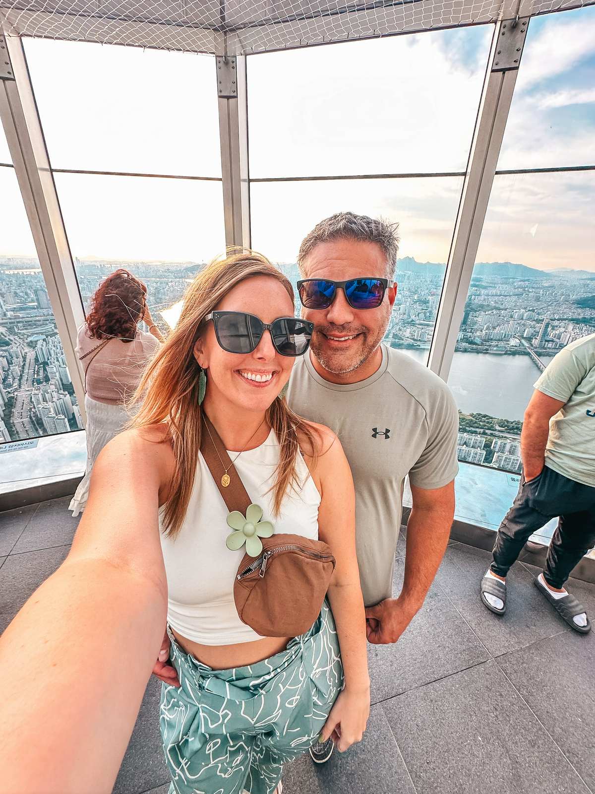 Couple posing at the Lotte World Tower in Seoul