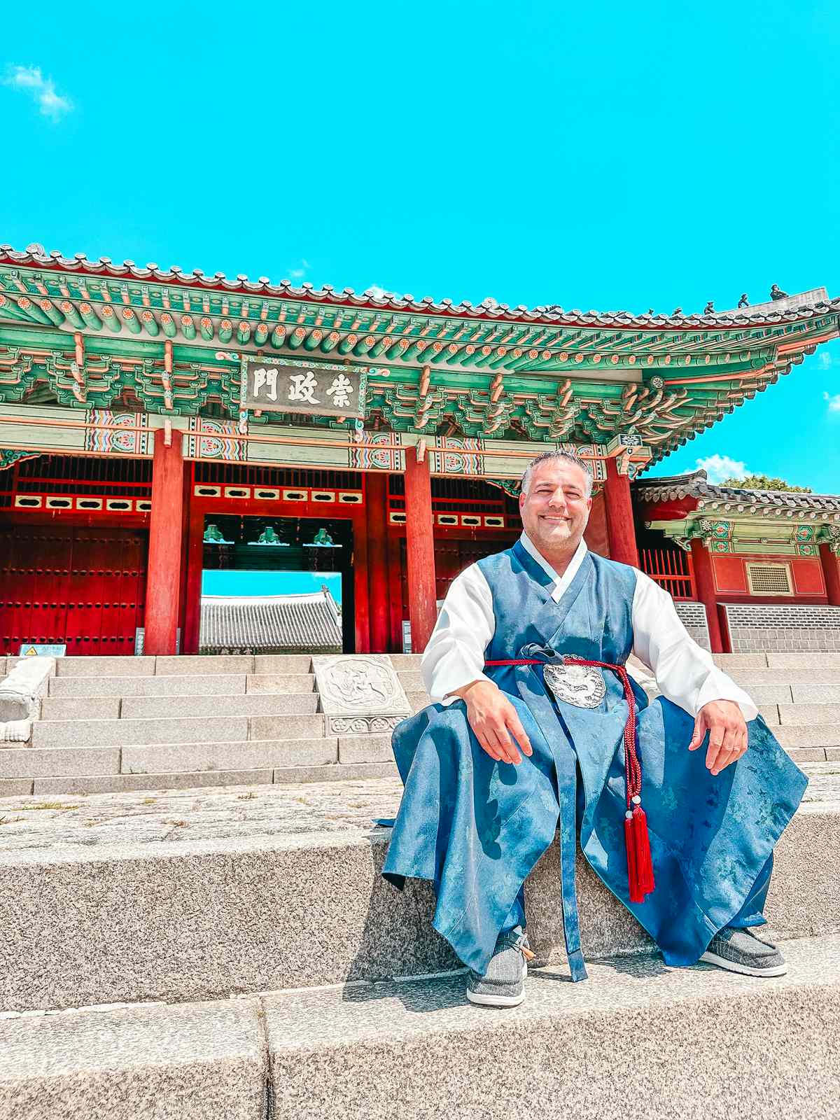 Man in hanbok rental outside of the Gyeonghuigung Palace in Seoul