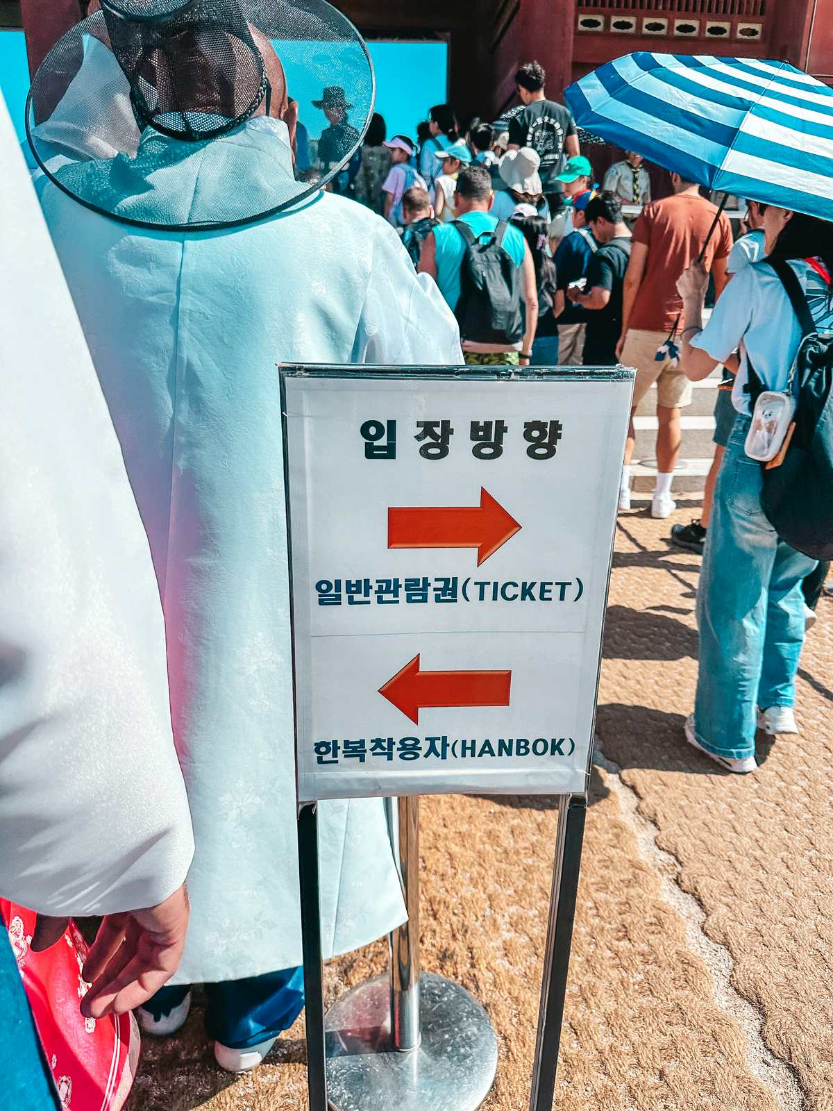 Signage for hanbok rental into the Gyeongbokgung Palace in Seoul