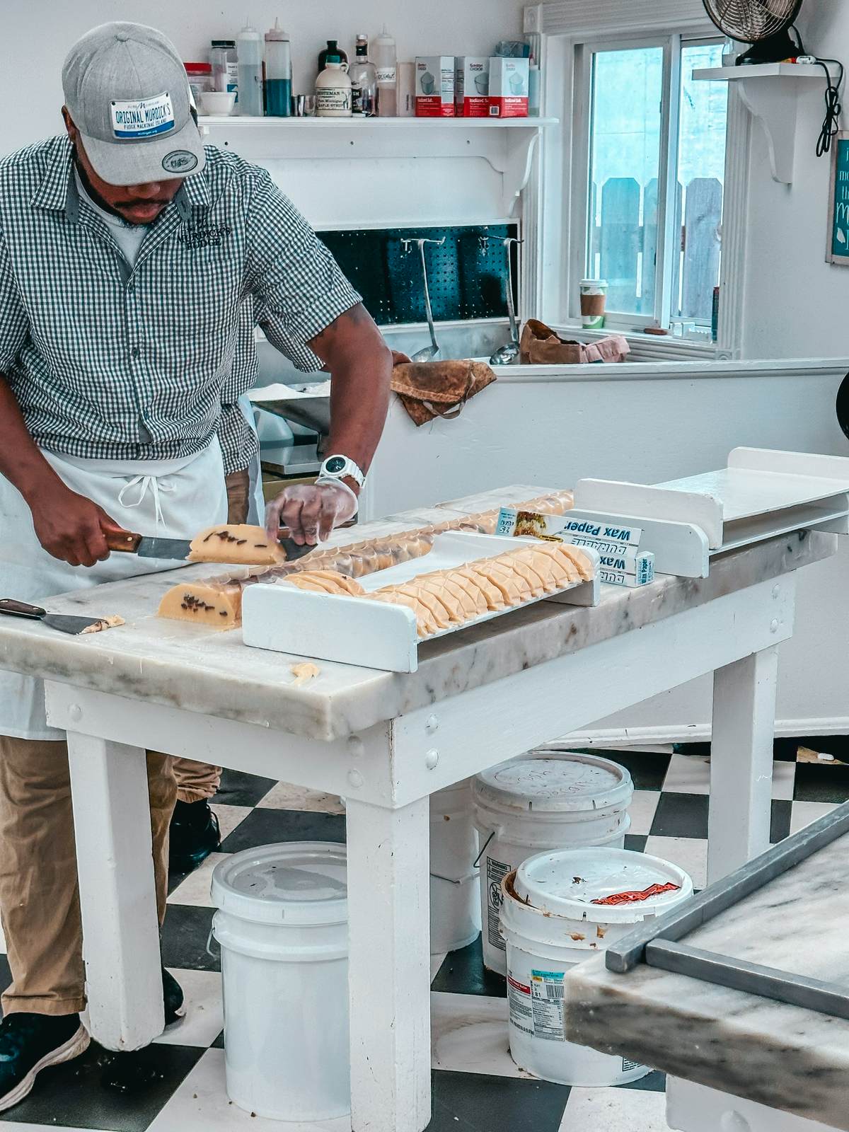 Slicing fudge at Murdicks Fudge on Mackinac Island