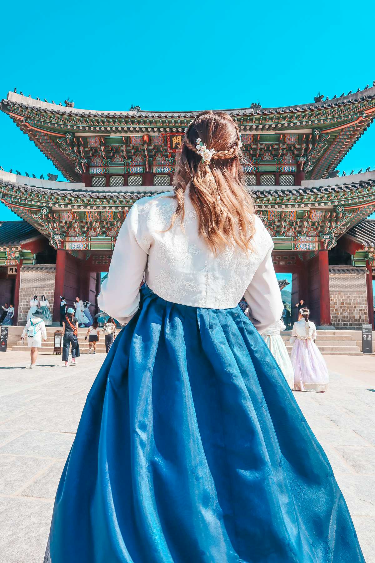 Wearing a hanbok in front of the Gyeongbokgung Palace in Seoul