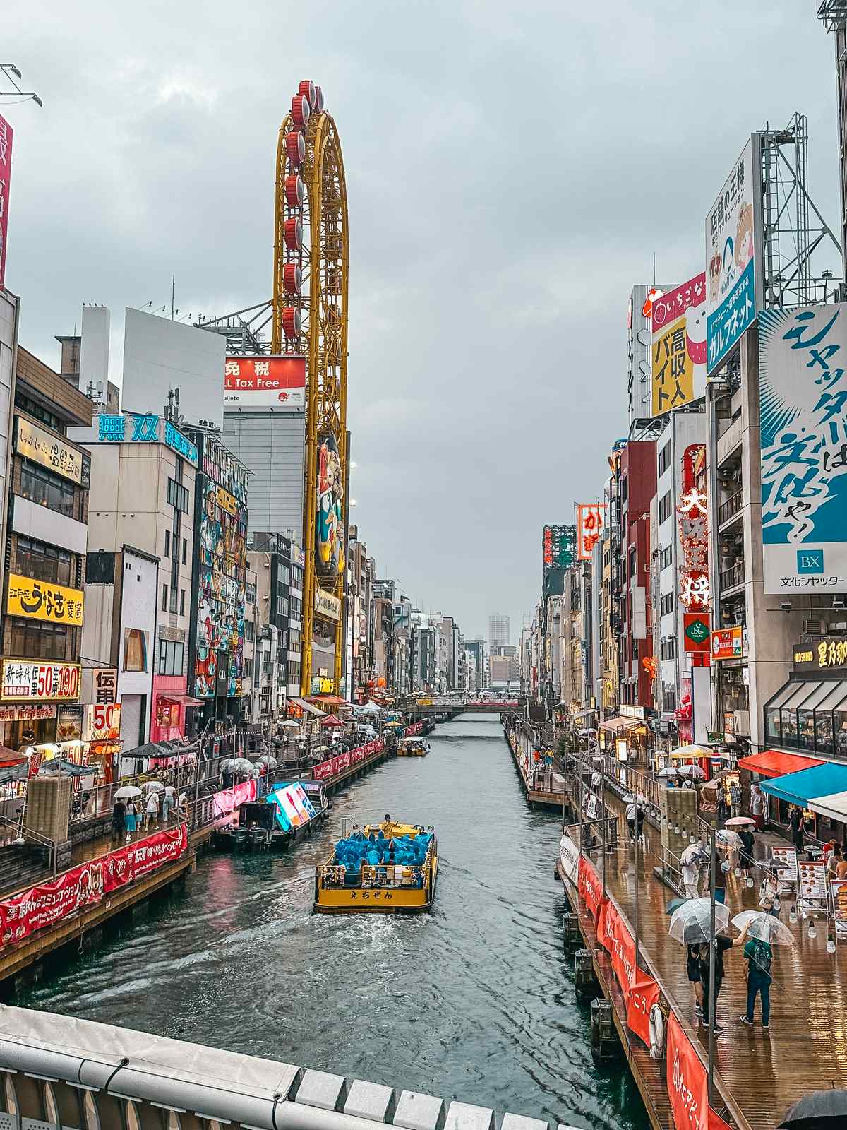 Boat going down the Dotonbori Canal in Osaka