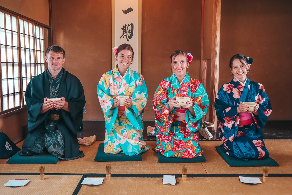 Group of friends experiencing a Traditional tea ceremony in Kyoto