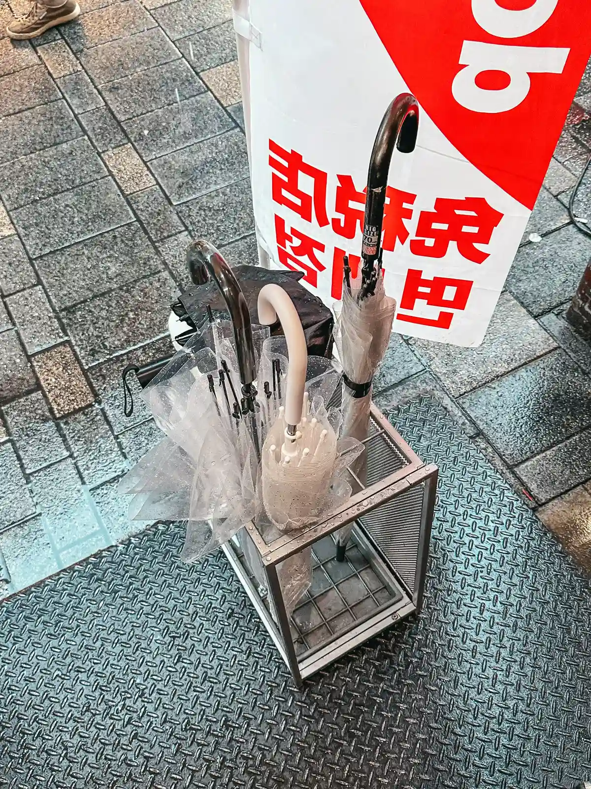 Umbrella holder outside of store in Tokyo