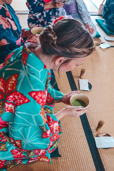 Bowing at a traditional tea ceremony in Kyoto with kimono